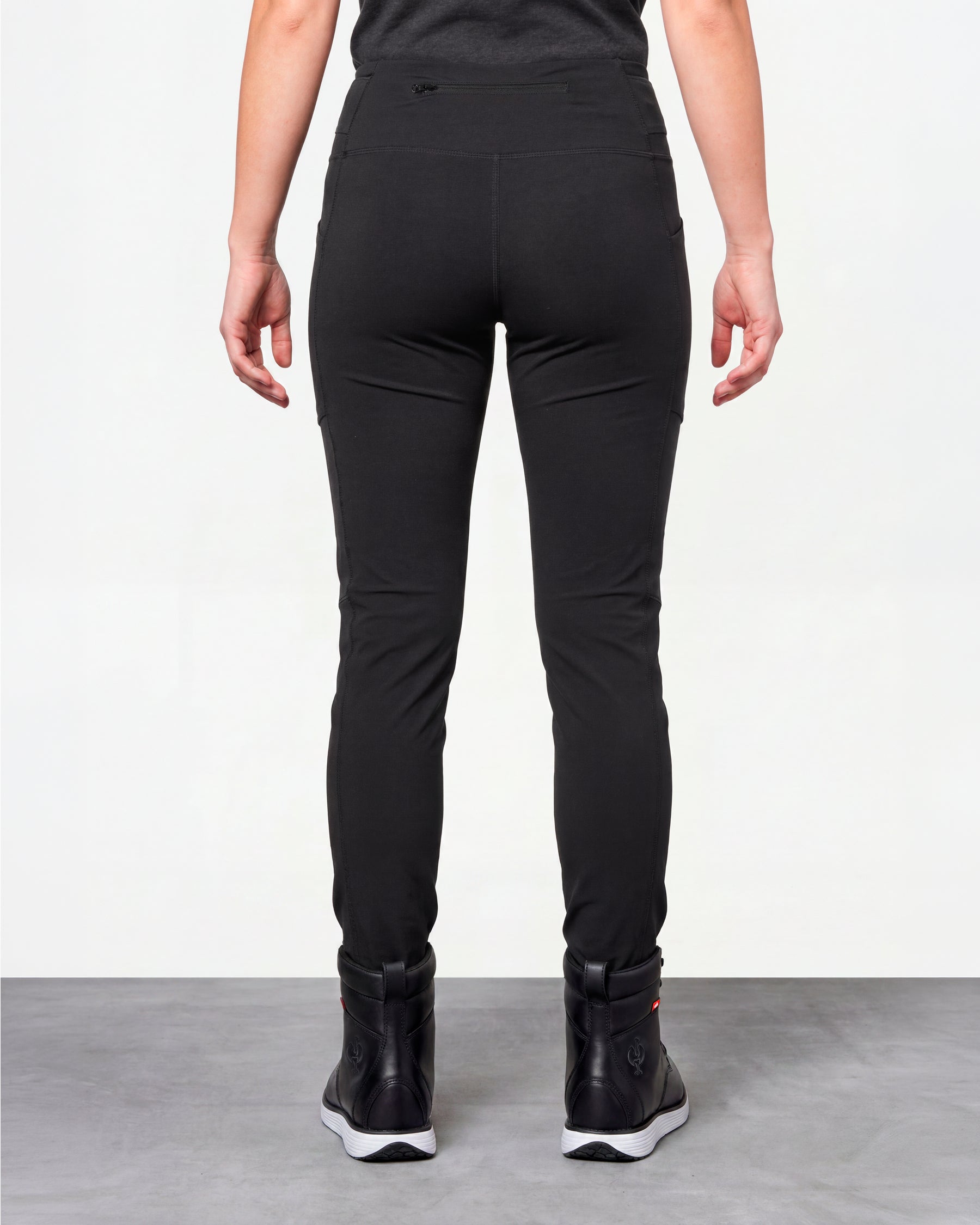 Women's Functional Leggings e.s.trail pure in black worn by a model, rear view