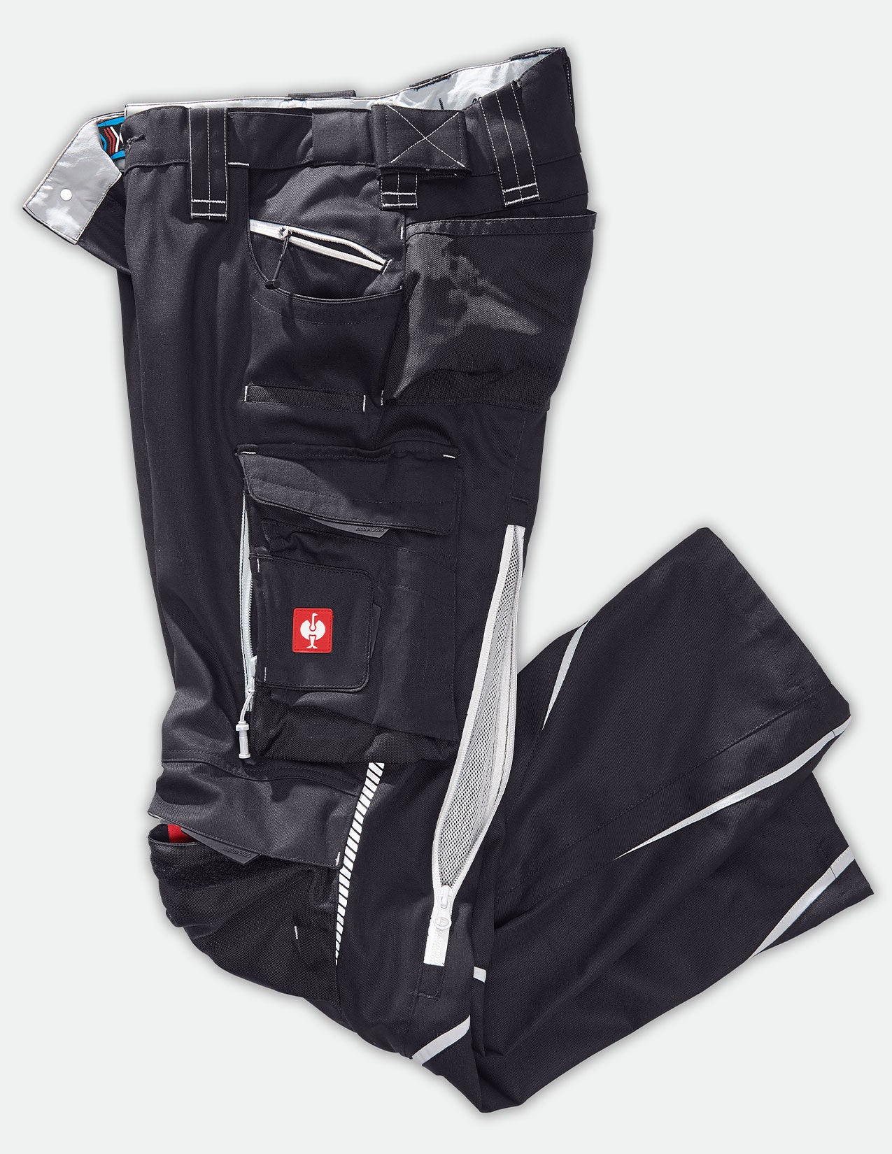 Black pants with zippers and a red logo on a white background