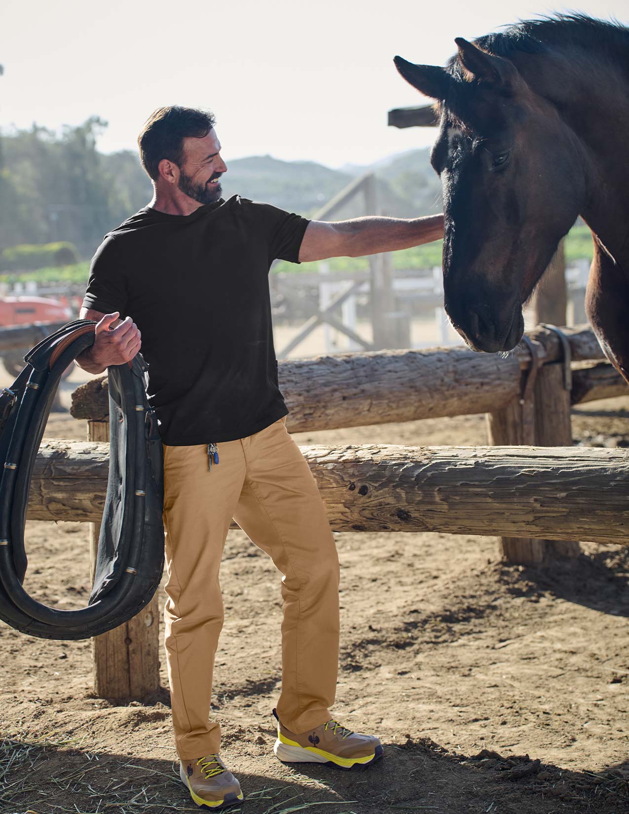 Man interacting with a horse in an outdoor setting