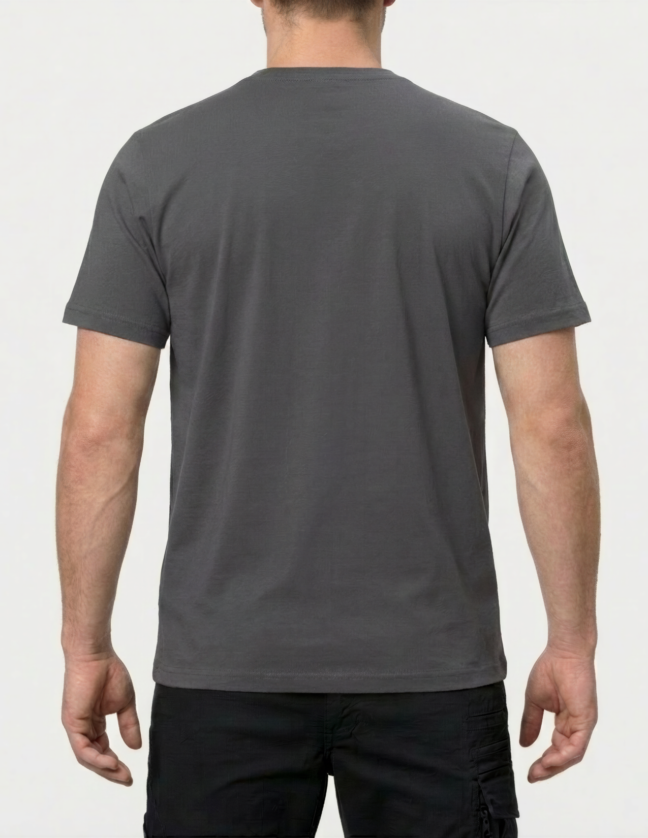 Person wearing a gray t-shirt on a white background
