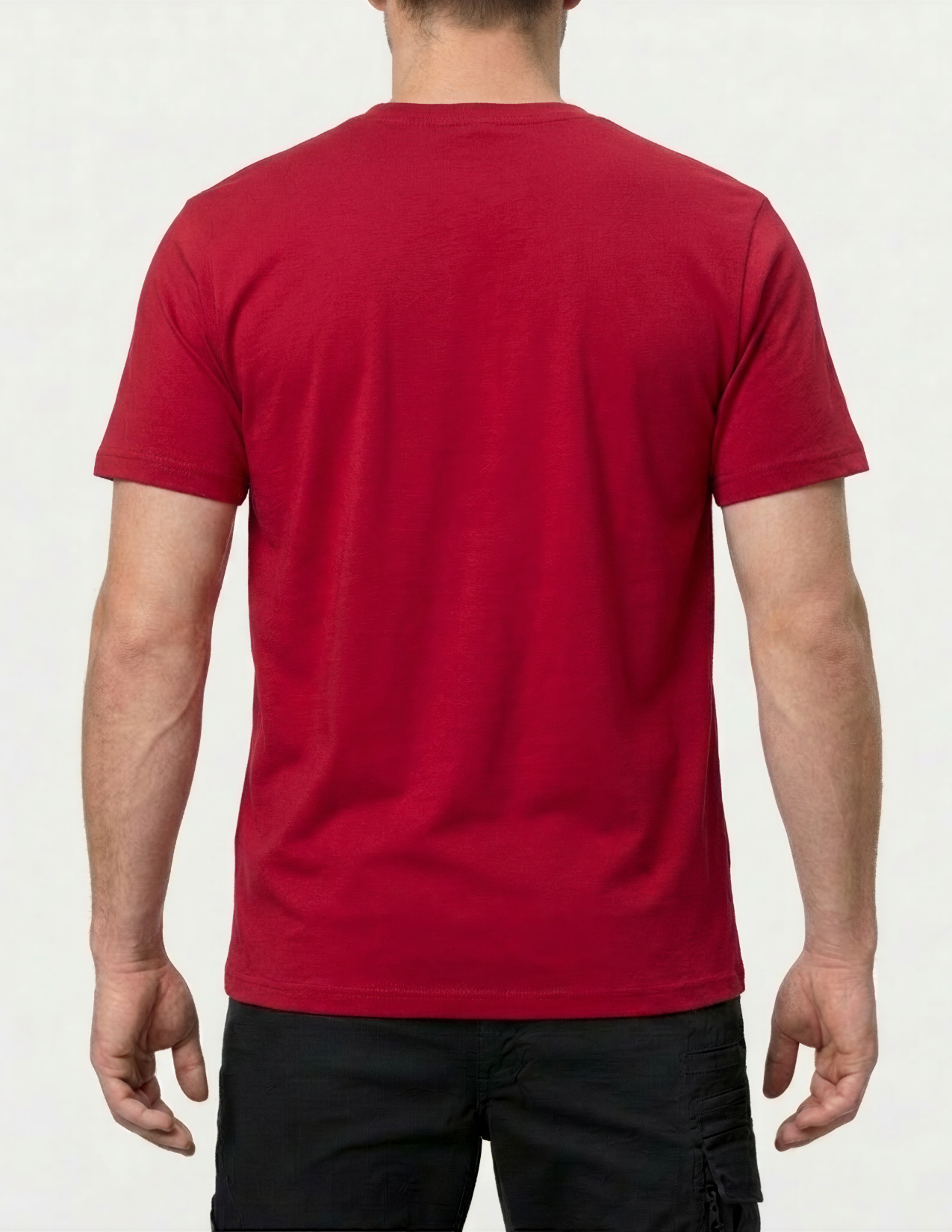 Person wearing a red t-shirt on a plain background