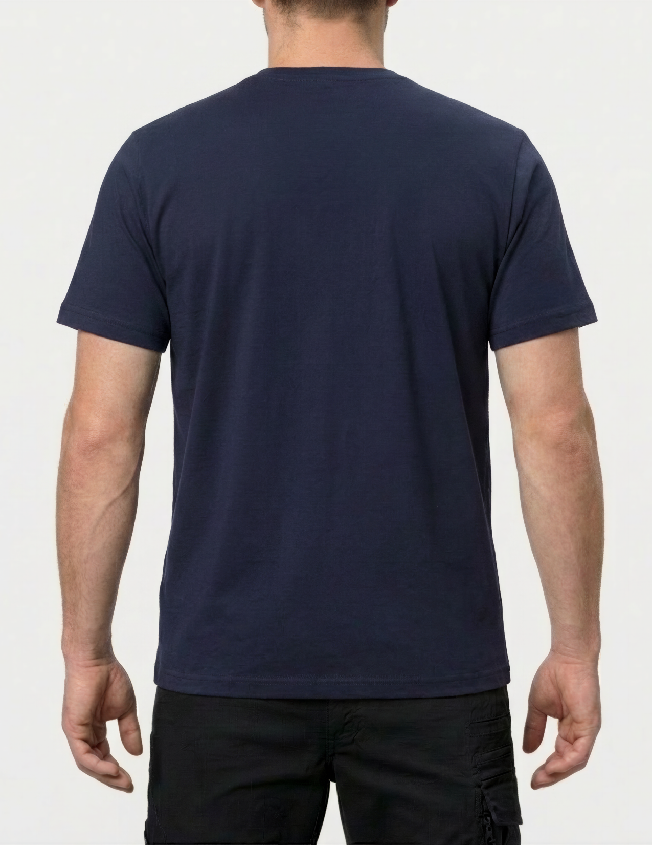 Person wearing a navy blue t-shirt on a white background