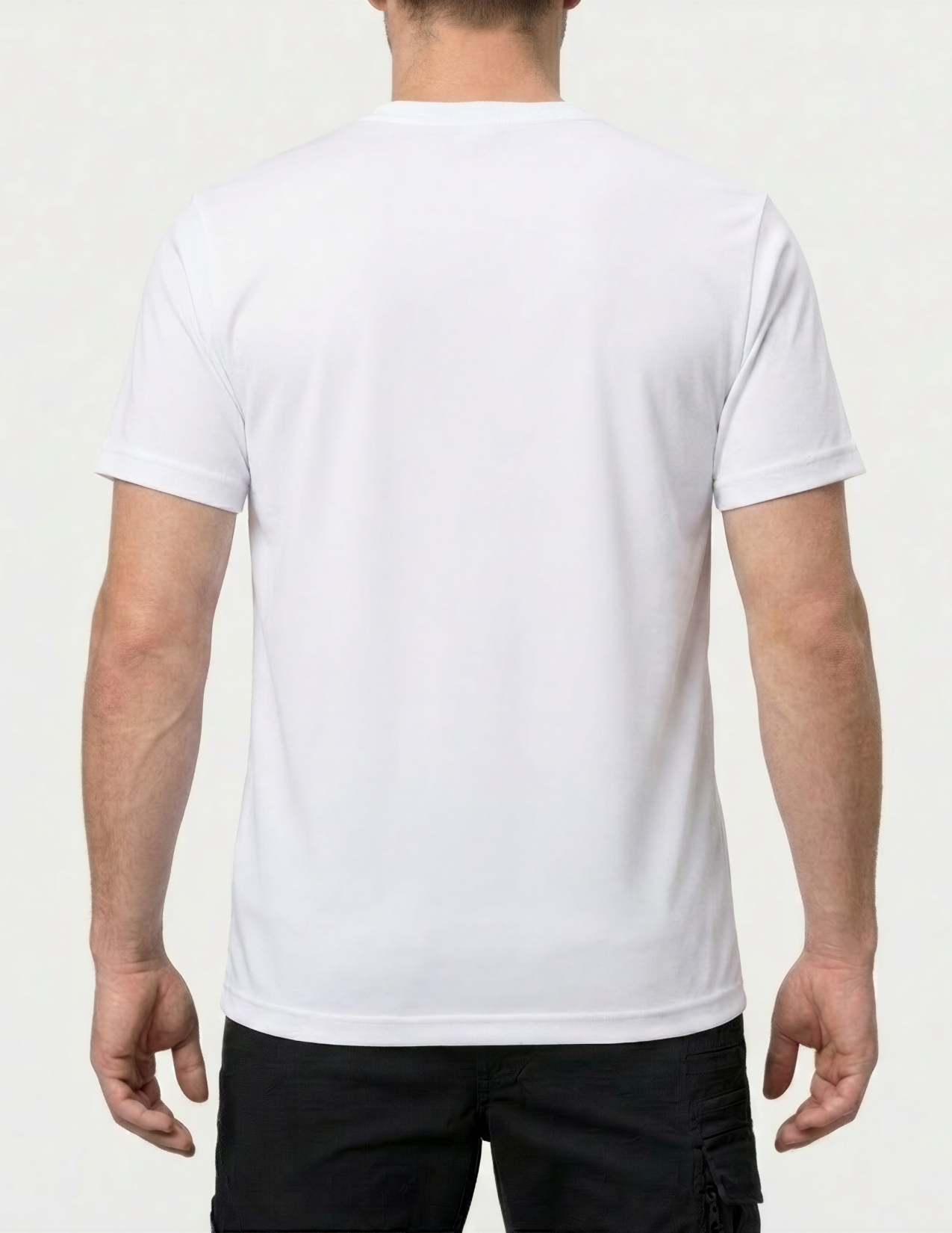 Person wearing a white t-shirt on a white background