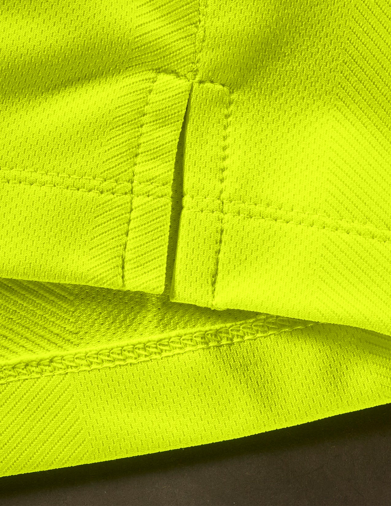 Close-up of bright yellow fabric with textured pattern