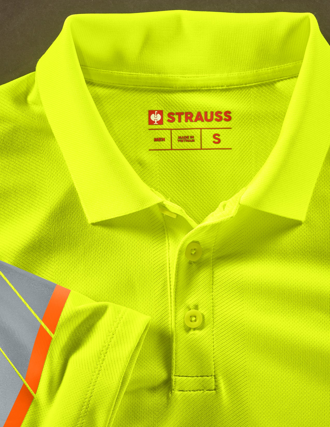 Yellow polo shirt with Strauss logo on a dark background