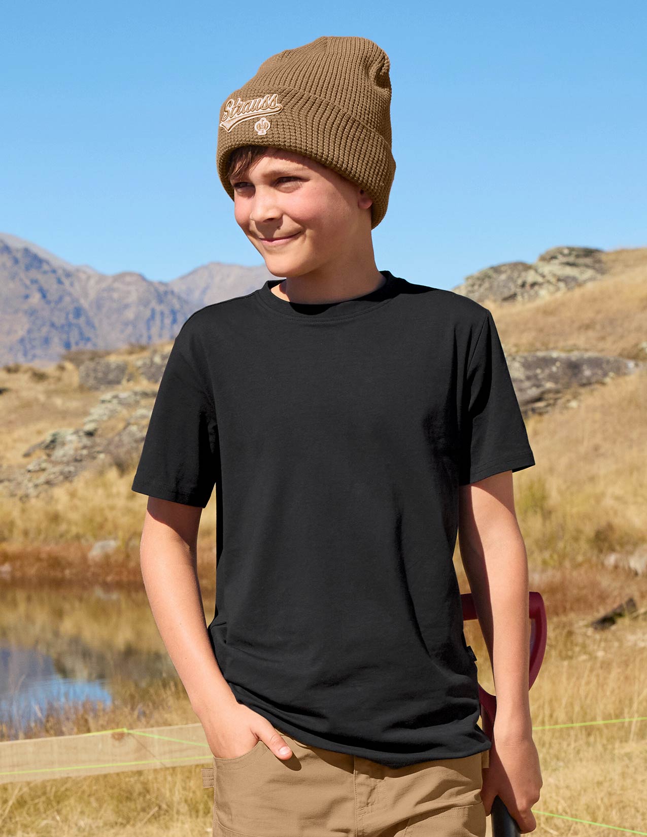 Child with a beanie and black T-shirt