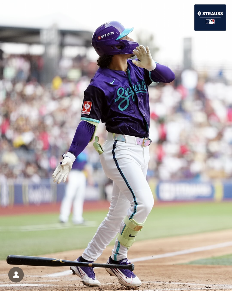 An MLB player looks off a big hit from home plate in the 2026 CDMX series game.