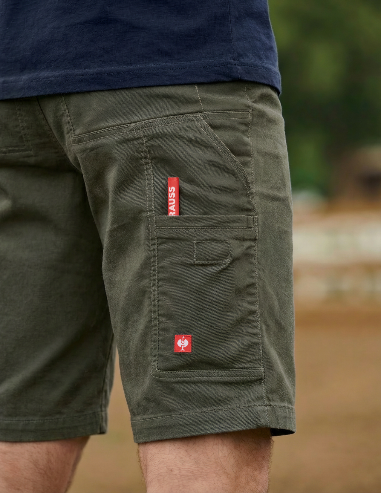 Green shorts with red labels on a blurred background