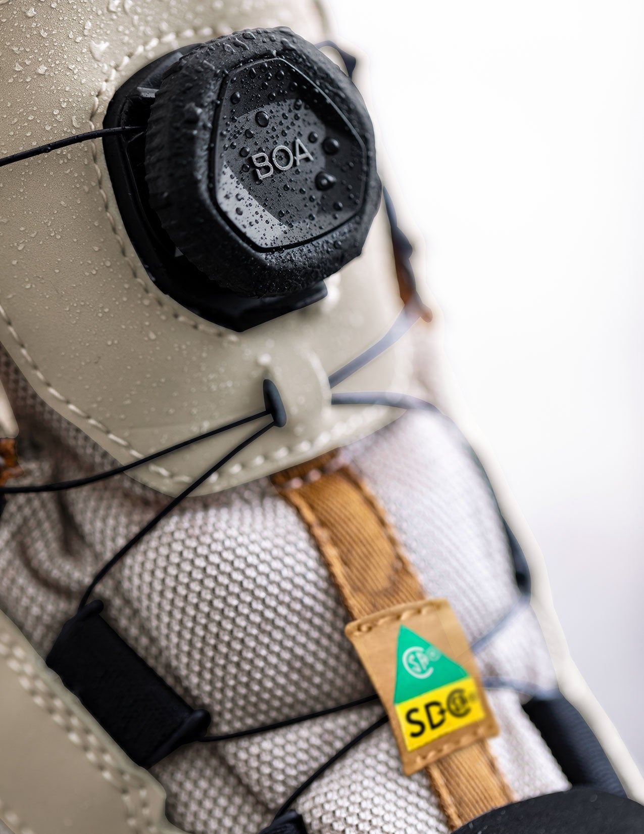 Close-up of a shoe with BOA system and a visible brand label.