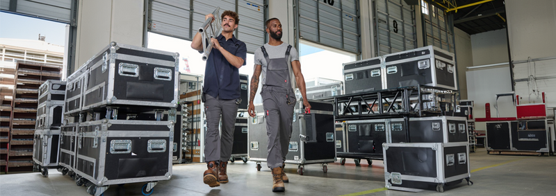 Two men walking in a warehouse
