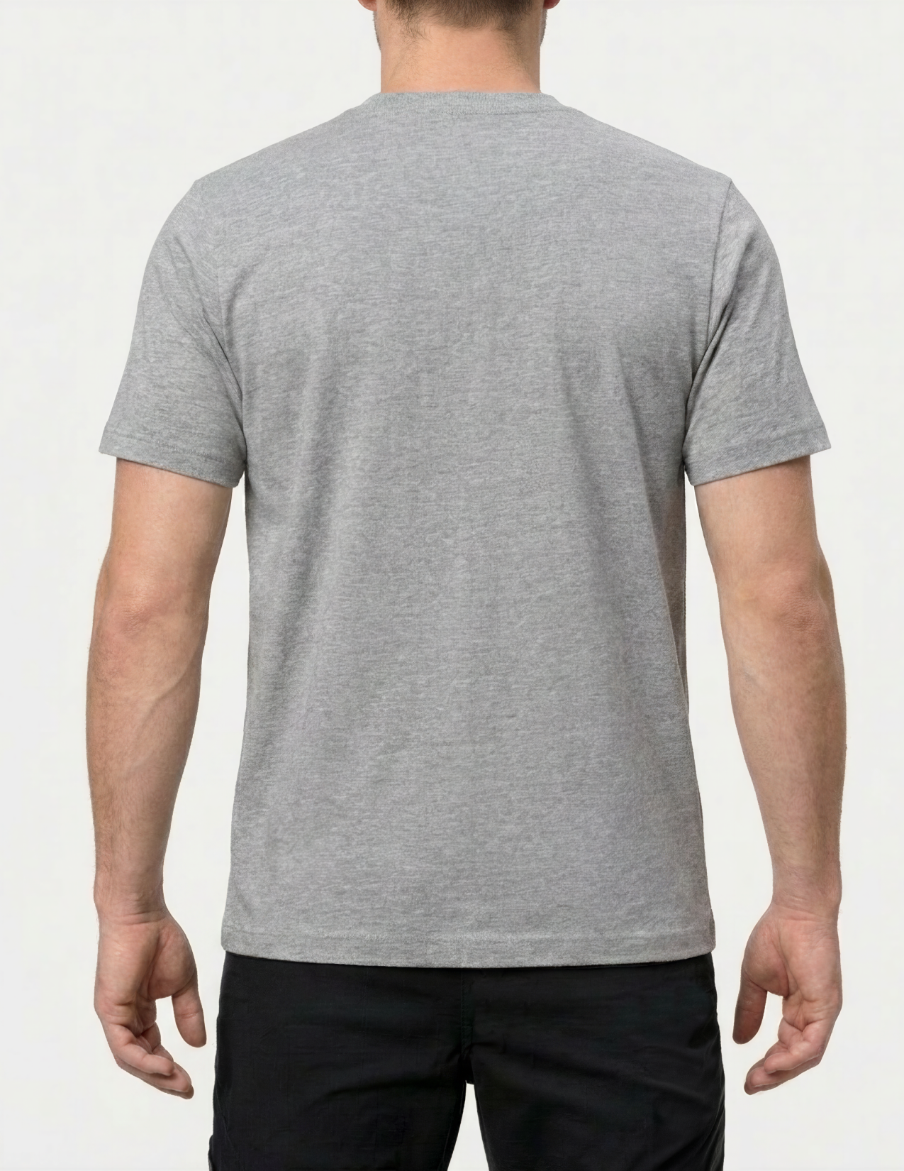Person wearing a gray t-shirt on a white background