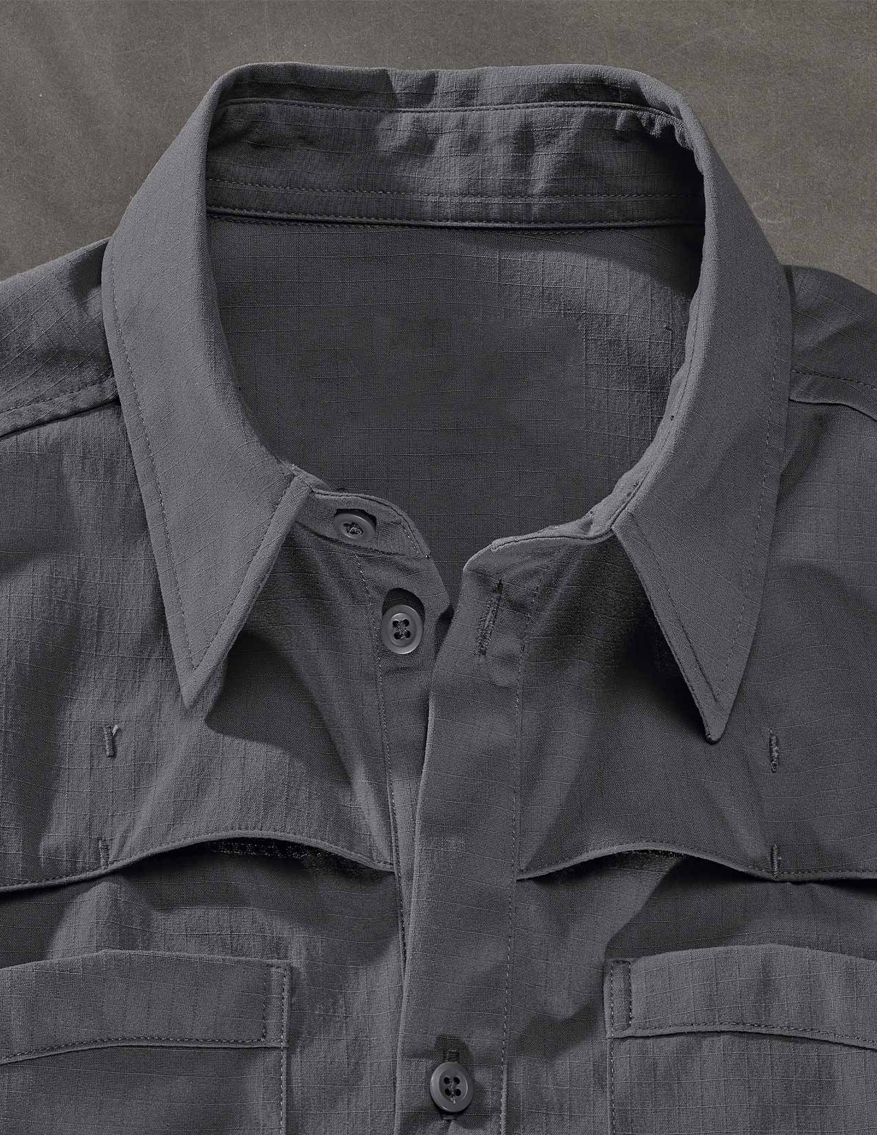 Dark gray shirt with collar and buttons on a matching background