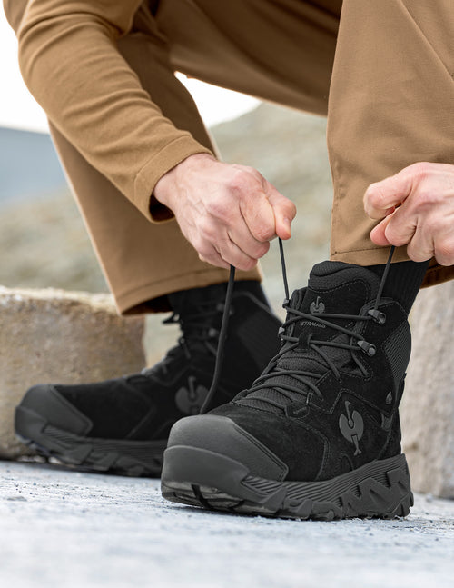 a person tying their shoes