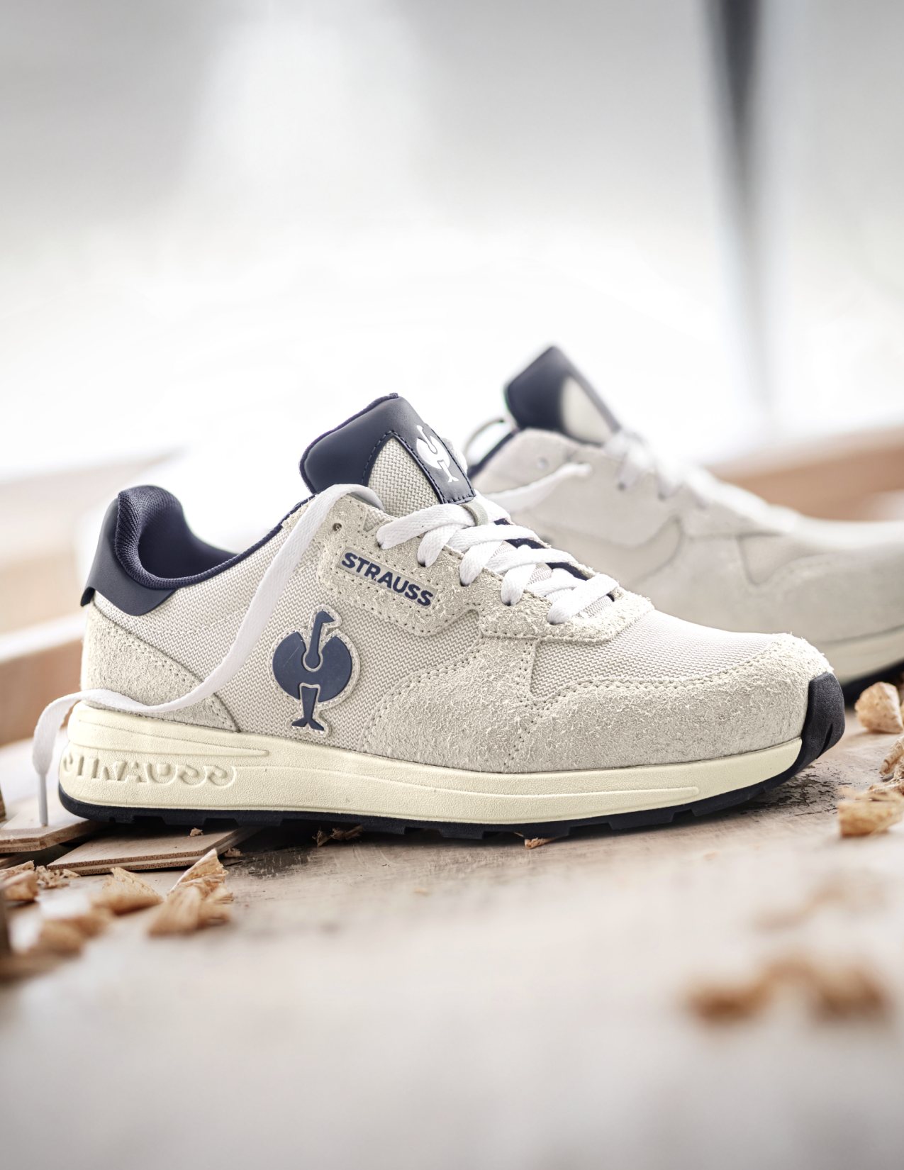 White sneakers with blue accents on a light background