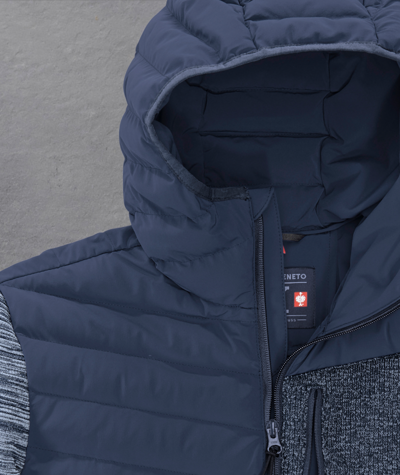 Close-up of STRAUSS e.s.motion ten Hybrid Hooded Jacket showing the hood and weather-ready fabric.