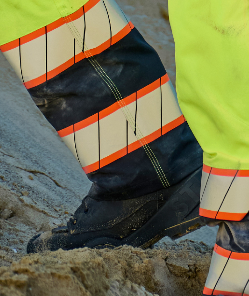Close-up of STRAUSS High Visibility Work Pants showing the reflective details.