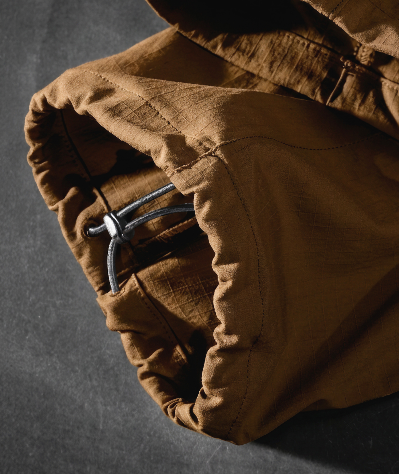 Close-up of STRAUSS e.s.taktik Stretch Ripstop Cargo Work Bib Overall showing the adjustable hem.