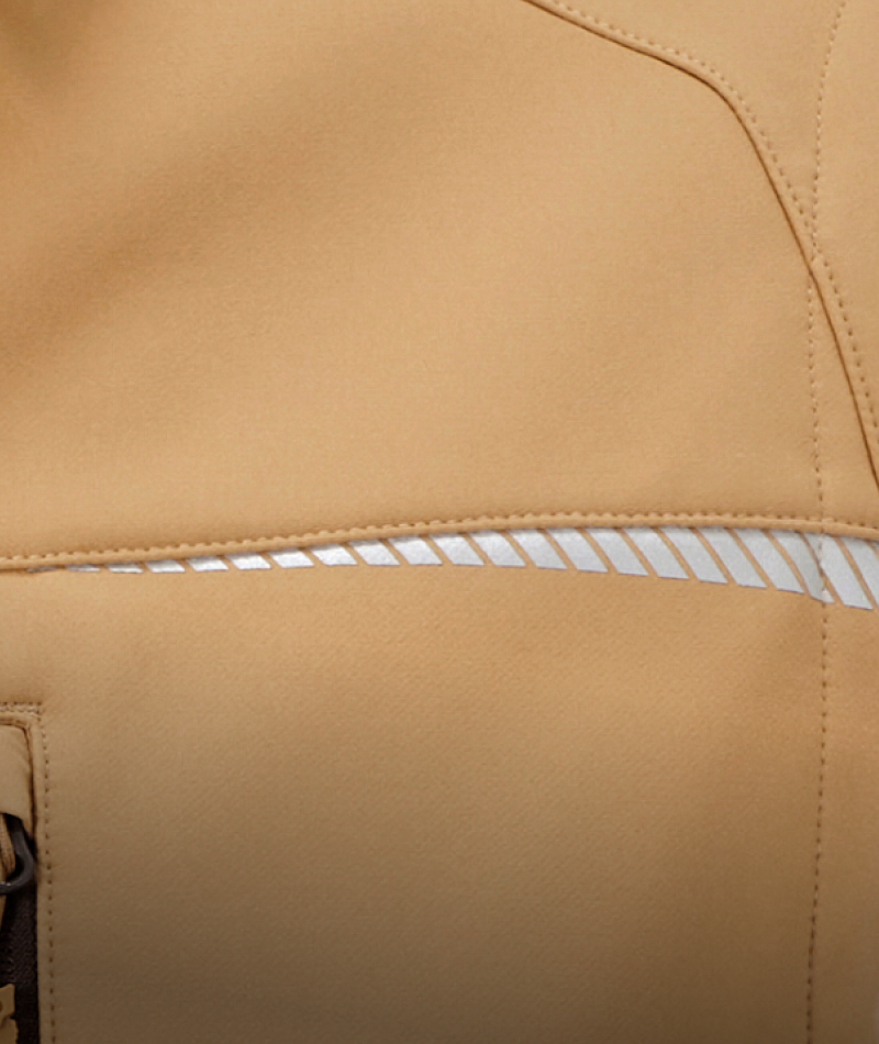 Close-up of a tan leather jacket showing a horizontal zippered pocket with a white striped interior lining and matching tan stitching.