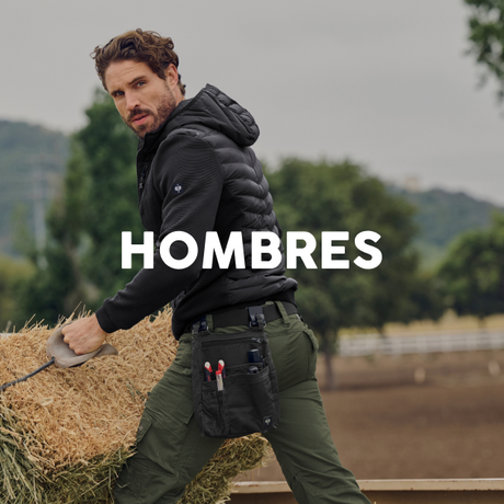 Man carrying a hay bale with 'HOMBRES' text overlay in an outdoor setting