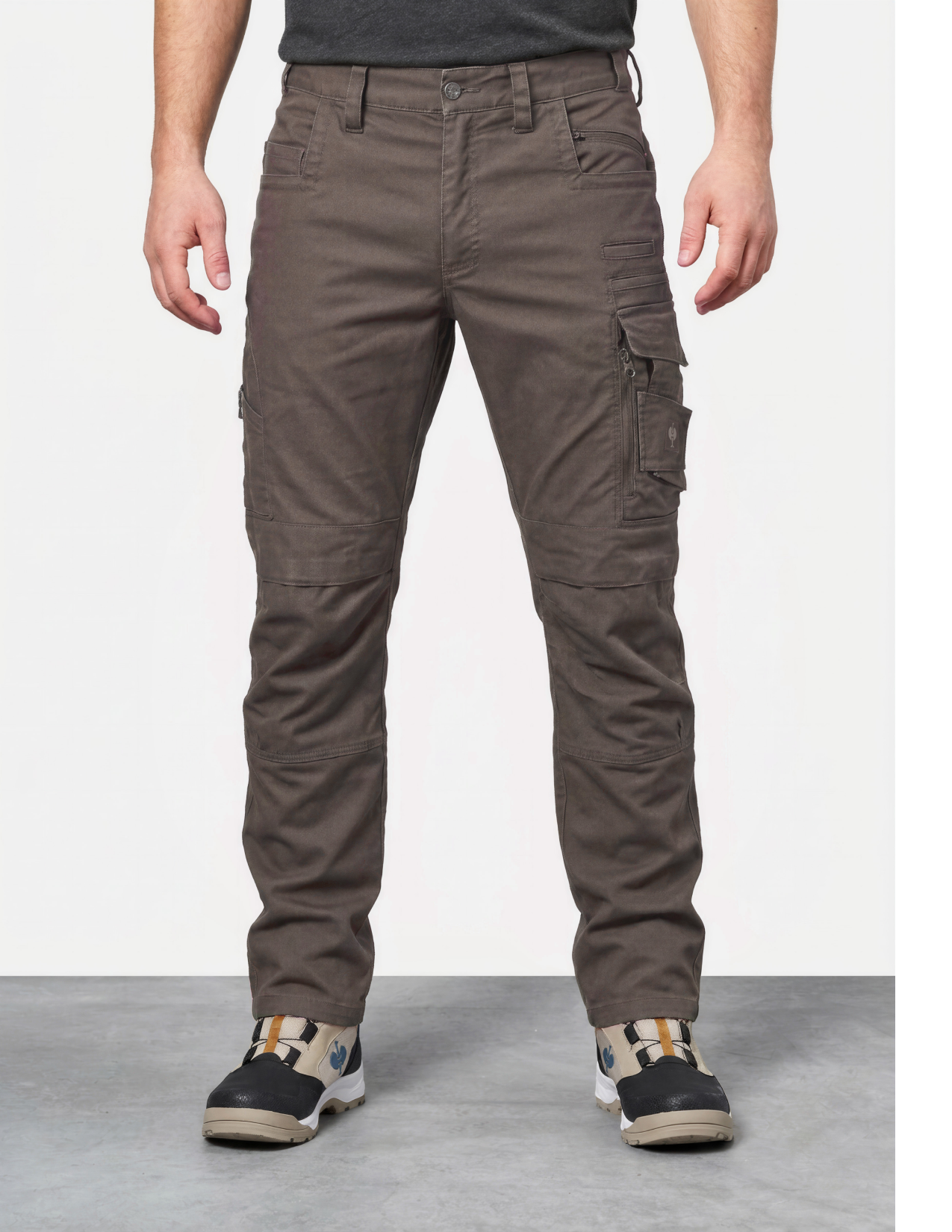 Brown cargo pants worn by a person on a white background