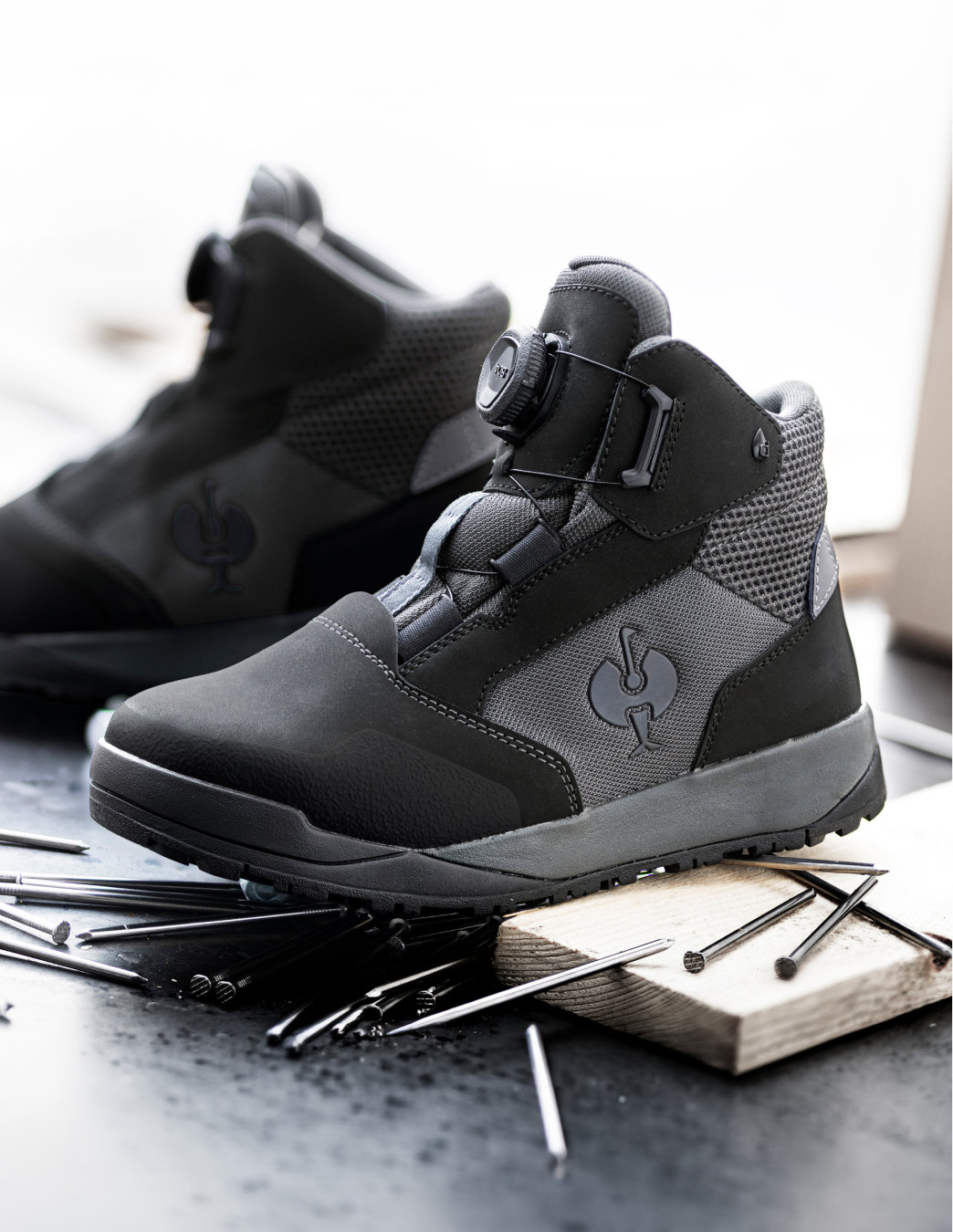 STRAUSS Murcia Mid Steel Toe Work Boots in carbon grey, sitting on top of construction materials