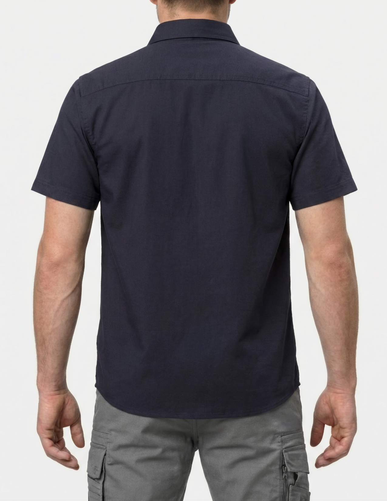 Person wearing a navy short-sleeve shirt on a white background